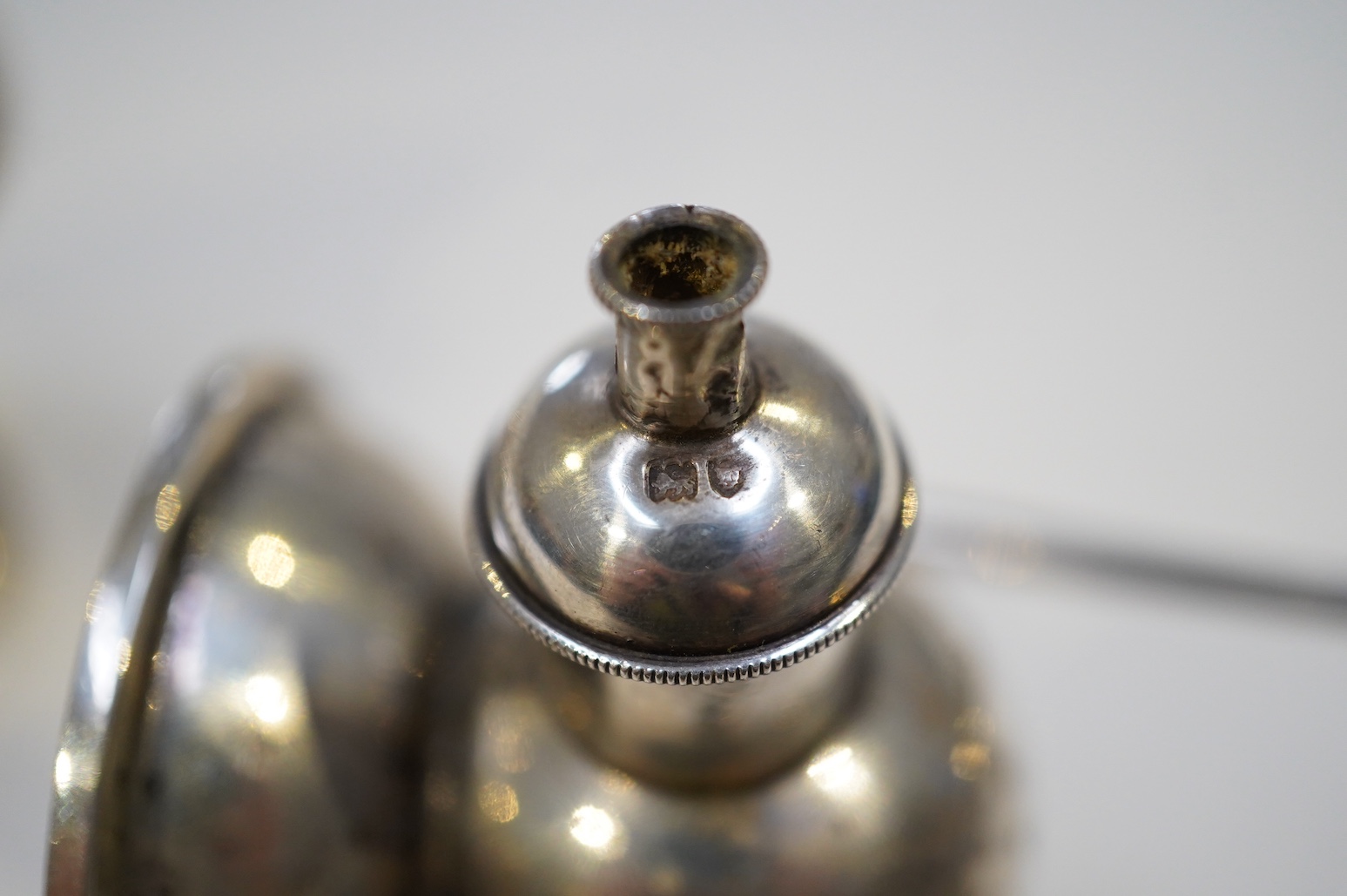 An Edwardian novelty cigar cutter and perpetual lighter, modelled as a pair of railway lamps, by Walker & Hall